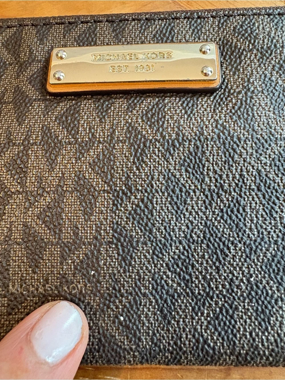 Michael Kors Brown and Tan Signature Wristlet with Gold Plate